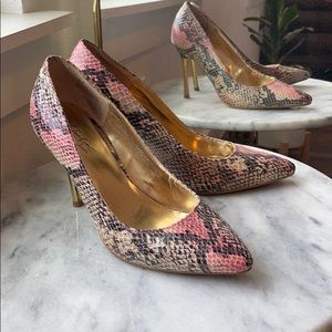 Snakeskin pumps with gold heel